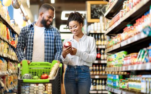 Black/African American couple grocery shopping.