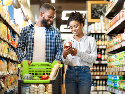 Man and woman grocery shopping.